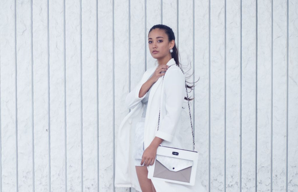 white outfit match with a bag
